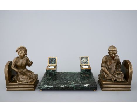 An art deco green marble inkwell and a pair of figurative book ends, 20th C. H.: 21,5 cm (the bookends) Condition reports and