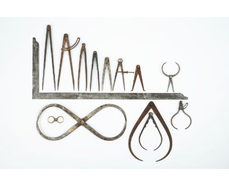 A set of wrought iron compasses and measuring tools, 18/19th C. Various dimensions. Condition reports and high resolution pic