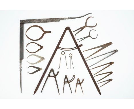 A set of wrought iron compasses and measuring tools, 18/19th C. Various dimensions. Condition reports and high resolution pic