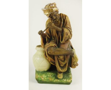 Early 20th Century Austrian Amphora Porcelain Figure, Arab Man Playing Flute. Impressed marks to base. Rubbing to Gilt Decora