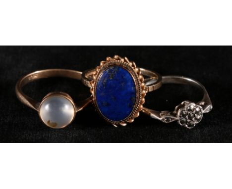 9ct gold oval hardstone cabochon set dress ring size O, a 9ct gold moonstone ring and a silver marcasite set ring (3)