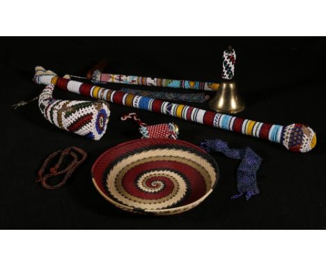 Group of mid 20th century beaded and woven items including a pipe, horn, bell, stick etc