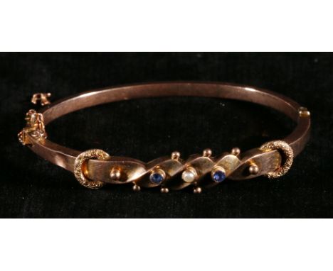 Victorian 9ct gold pearl and sapphire bangle, 5.8 grams CONDITION REPORT: Dented just above the clasp measures 4mm
No further