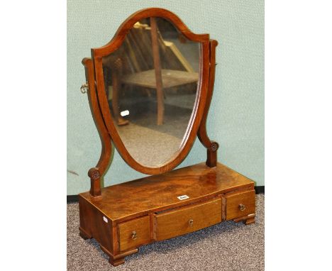 19th century mahogany and inlaid toilet mirror of shield form raised on platform base fitted three drawers on squat bracket f