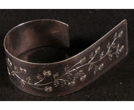 Modern Scottish silver bangle with engraved floral decoration by W C F Edinburgh