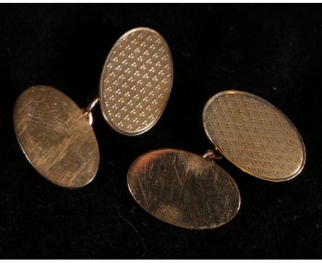 Pair of 9ct gold cufflinks with engine turned decoration. 10.2g