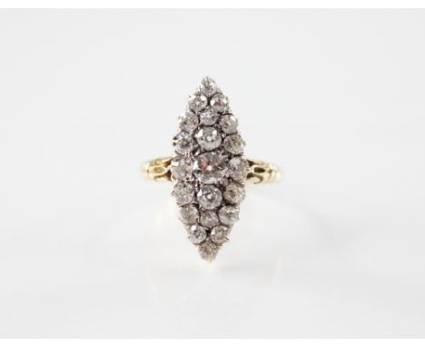 A Victorian diamond marquise cluster ring, the central old cut diamond measuring approximately 4.5mm W x 2.5mm D, within a su