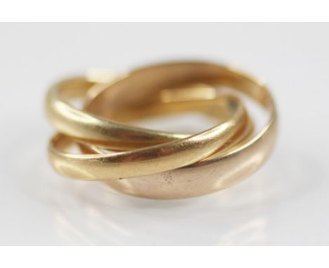 A trinity ring, comprising three interlocking bands, one 18ct gold, marked for Birmingham 1929, one 22ct gold, marked for Che