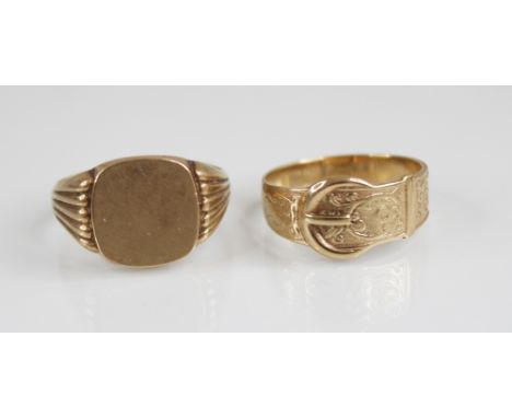 A 9ct gold signet ring, designed as a rounded square panel set to reeded tapering shoulders and plain polished shank, marks f