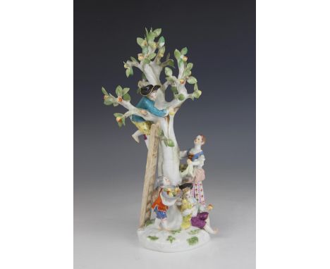 A Meissen porcelain figural group after the model by J. J. Kaendler, modelled as a boy on a ladder picking apples from a tree