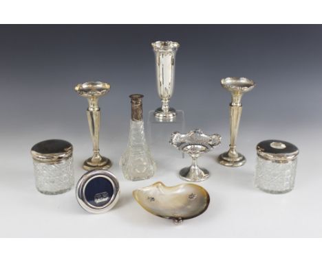 A selection of silver, silver coloured and cut glass dressing table ware, to include a pair of silver weighted posy vases, Ja