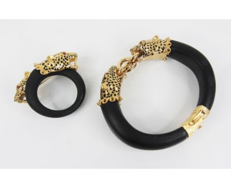 A Franklin Mint Duchess of Windsor Panther bangle, modelled as two panther heads with 22ct gold plating, ruby set eyes and bl