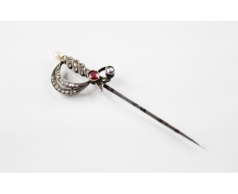 A Victorian dress sword pin, red gemstone to guard centre, rose cut diamonds to grip and knuckle bow, with off-round pearl to