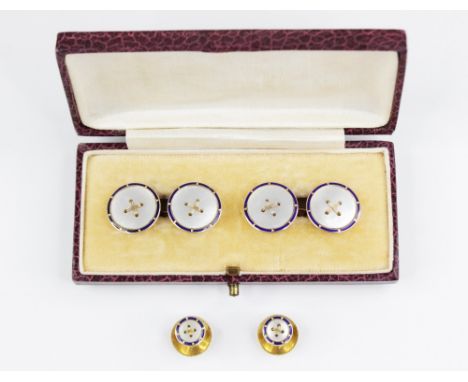 A pair of early 20th century 9ct gold, mother of pearl and enamel cufflinks, each modelled as a round button with mother of p