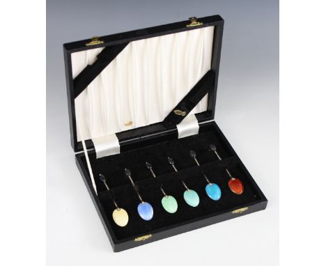 A cased set of six silver and enamel coffee spoons, Henry Clifford Davis, Birmingham 1953, each oval bowl with shell backs an