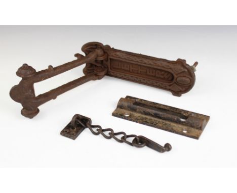 A cast iron combination door knocker and letter box, late 19th or early 20th century, the letter box surmounted by a cast mod