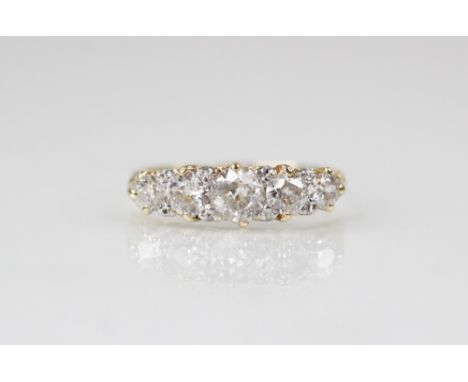 A Victorian five-stone diamond ring, the central old cut diamond measuring 4.88mm W x 2.44mm D, with two further graduated ol