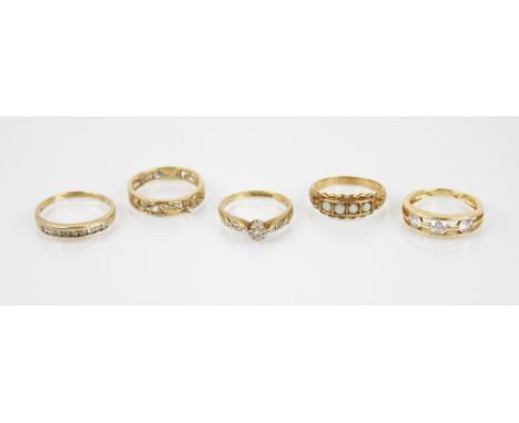 A diamond set 9ct gold half eternity ring, comprising nine round cut diamonds (total diamond weight 0.25 carats), channel set