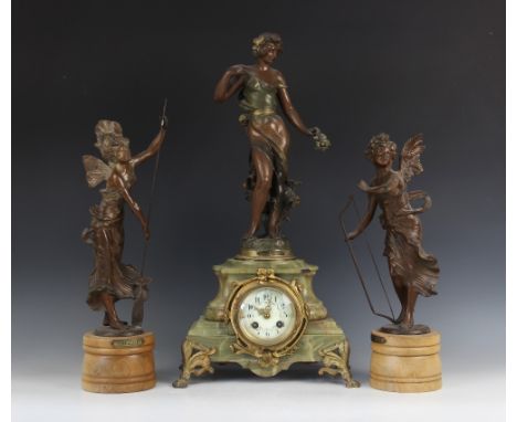 A 19th century French onyx and gilt metal mantel clock, the architectural green onyx clock case surmounted with a bronzed spe