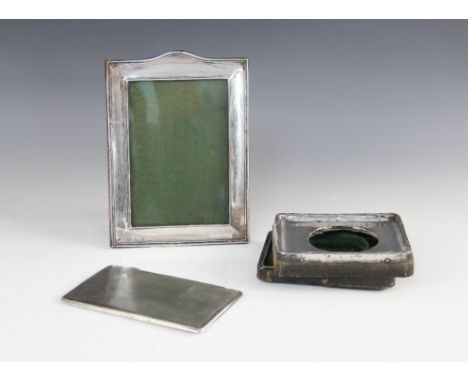 An Art Deco silver cigarette case, Mayes, Mills & Co, Birmingham 1934, of rectangular form with engine turned decoration, vac