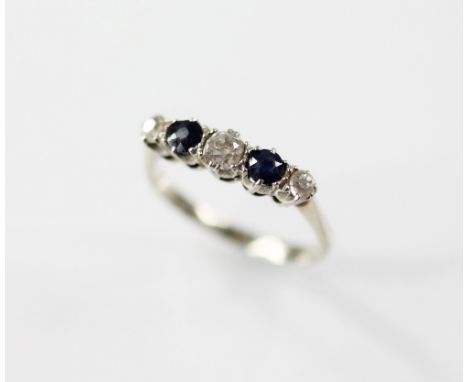 An early 20th century diamond and sapphire five-stone ring, designed as three old cut diamonds and two mixed cut sapphires, p