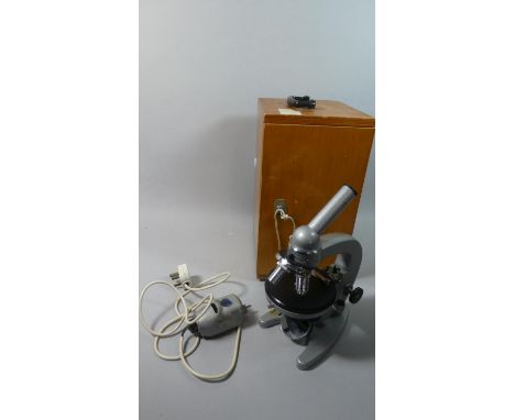 A Vintage Cased Russian Microscope with Electric Light 