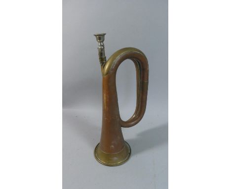 A Military Copper and Brass Bugle, 30cm high 