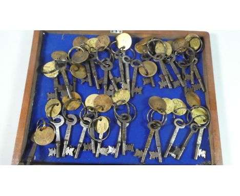 A Collection of Various Vintage Keys with Brass Tags 