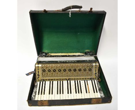 A cased Tonella piano accordion (af).  Condition Report: One black key missing, with further losses visible throughout the ca