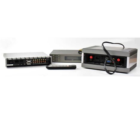 A Quad Audio System, comprising a Quad FM4 tuner, a Quad 99 pre-amplifier, and a Quad 909 amplifier, also a remote control, c