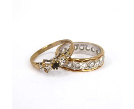 A 9ct yellow and white gold eternity ring set with white stones, and a 9ct gold dress ring with bow-shaped top (missing centr