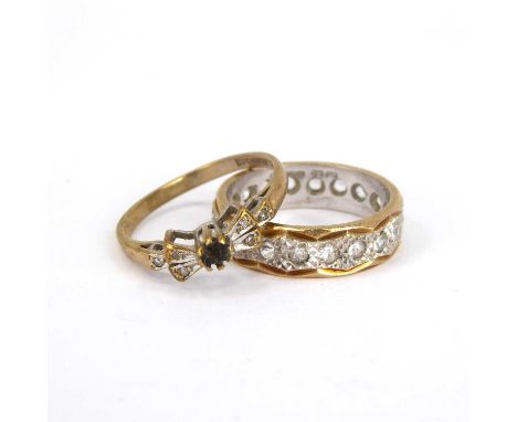 A 9ct yellow and white gold eternity ring set with white stones, and a 9ct gold dress ring with bow-shaped top (missing centr