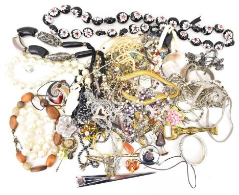 A quantity of costume jewellery comprising necklaces, brooches, coin pendants, cufflinks, tie clips, a small unusual brass pa