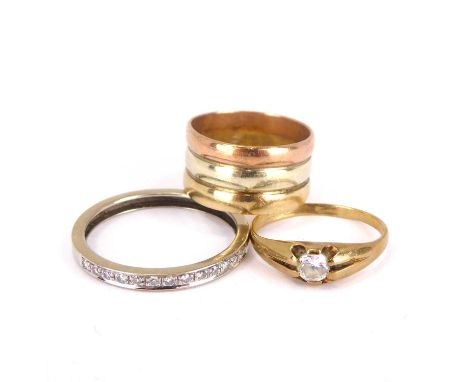 Three 9ct gold rings comprising a three-colour band ring, size H, a 9ct gold small ring with claw set white stone, size G, an