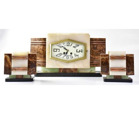 A French Art Deco eight-day mantel clock garniture, the hexagonal dial set with Arabic numerals, flanked by brown marble tape