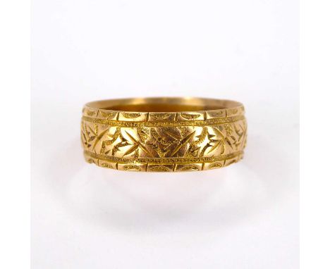 An 18ct gold band ring with textured pattern, size Q, approx. 4.2g.