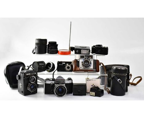 Five cameras comprising a Praktica Super TL camera fitted with a Carl Zeiss Jena Tessar 2,8/50 lens, in leather case, an Agfa