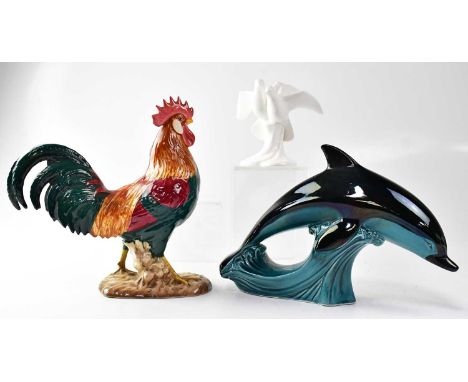 BESWICK; a model of a cockerel, no. 1892 'Leghorn', together with a Poole Pottery model of a leaping dolphin, a Heredities mo