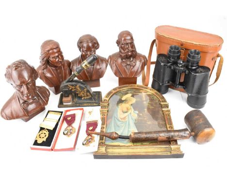 Various collectors' items comprising four resin busts of composers in a wood effect, a rustic pipe, a pair of binoculars in l