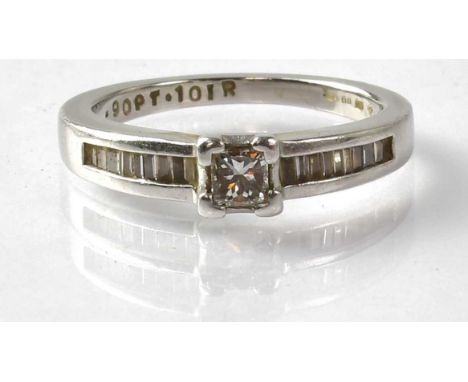 A platinum solitaire diamond ring with square cut central diamond, approx. 0.25ct, flanked with baguette cut diamonds to the 