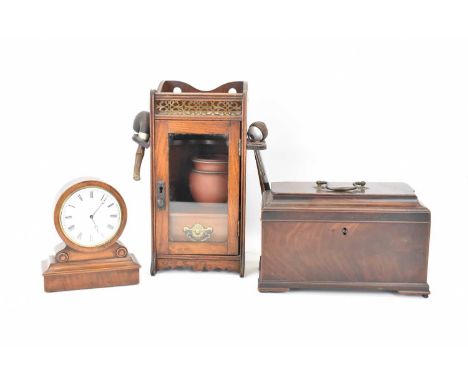 An early Victorian mahogany tea caddy with swing handle (af), 17 x 25cm, a mahogany desktop key wind clock with barrel moveme