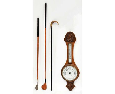 A wall-hanging oak banjo barometer and thermometer with carved oak leaf front, length 80cm (af), a horn-handled walking stick