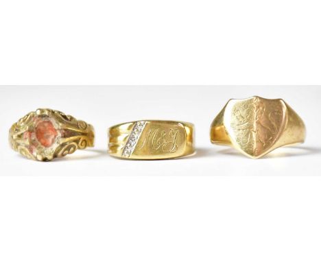 Three 9ct gold rings (one lacking stone), size K, a shield-shaped signet ring, size P, and a further signet ring with the ini