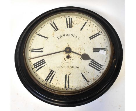 T. R. RUSSELL, LIVERPOOL; an ebonised station clock, the 13.5" white enamelled dial set with Roman numerals and inscribed wit