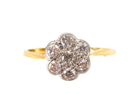 An 18ct gold flower head cluster ring of small diamond chips within platinum mount, size O, approx. 2.1g.Condition Report: Th