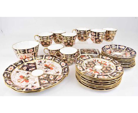 ROYAL CROWN DERBY; a twenty-seven piece part tea set in the 2451 pattern, comprising eight teacups, saucers, side plates, two