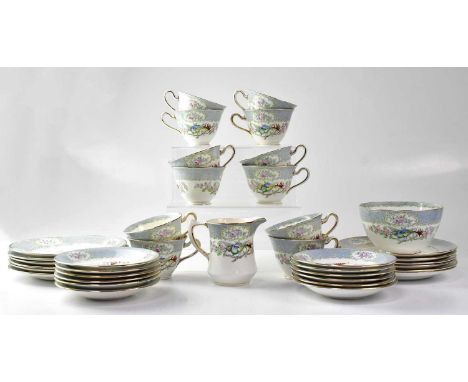 A Delphine part tea service with printed Asiatic pheasant and cherry blossom design, twelve cups and saucers, twelve side pla