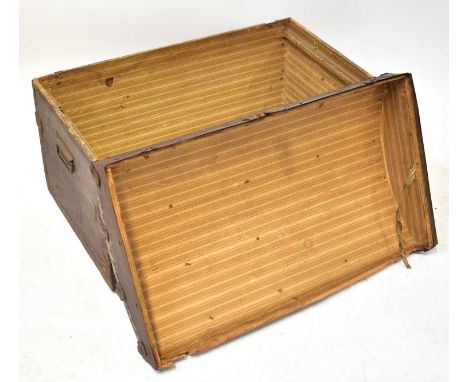 Three vintage trunks comprising a wooden brass bound dome-topped example, a studded green metal bound trunk with carry handle