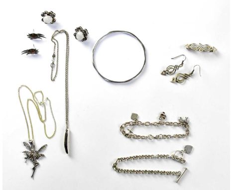A group of 925 silver jewellery, to include a bangle, a bracelet set with four charms, a further chain bracelet, a pair of ea