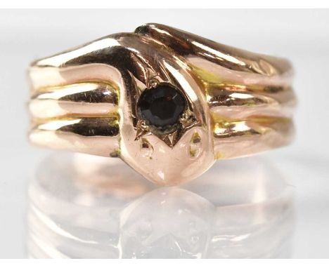 A 9ct yellow gold snake ring, the head set with a 0.15ct gemstone, size S, approx. 2.7g.